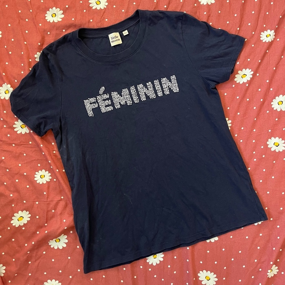 Woman's Small Little Moon top. The front says Feminin in white beads.